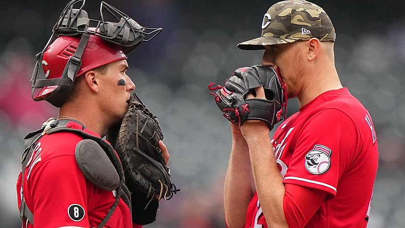 May 16, 2021; Denver, Colorado, USA; Cincinnati Reds starting pitcher Jeff Hoffman (23) and catcher Tyler Stephenson (37) talk on the mound in the fourth inning against the Colorado Rockies  at Coors Field. Mandatory Credit: Ron Chenoy-USA TODAY Sports