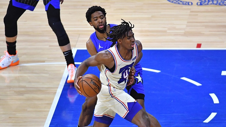 May 16, 2021; Philadelphia, Pennsylvania, USA; Philadelphia 76ers guard Tyrese Maxey (0) drives past Orlando Magic guard Chasson Randle (25) during the first quarter at Wells Fargo Center. Mandatory Credit: Eric Hartline-USA TODAY Sports