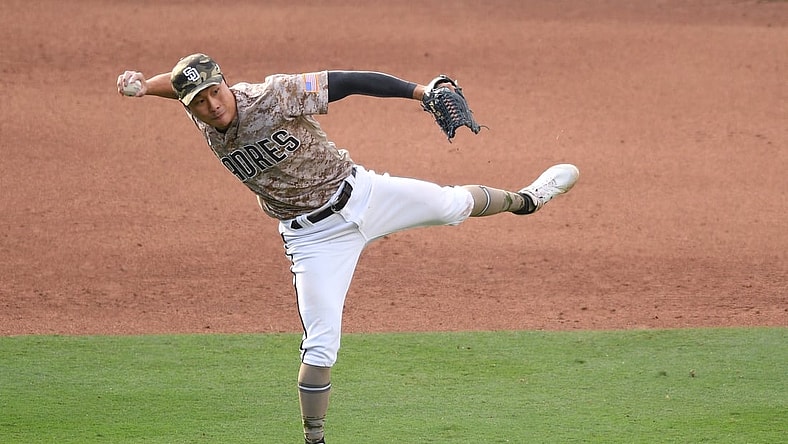 May 16, 2021; San Diego, California, USA; San Diego Padres shortstop Ha-seong Kim (7) throws to first base late on a single by St. Louis Cardinals first baseman Paul Goldschmidt (not pictured) during the sixth inning at Petco Park. Mandatory Credit: Orlando Ramirez-USA TODAY Sports