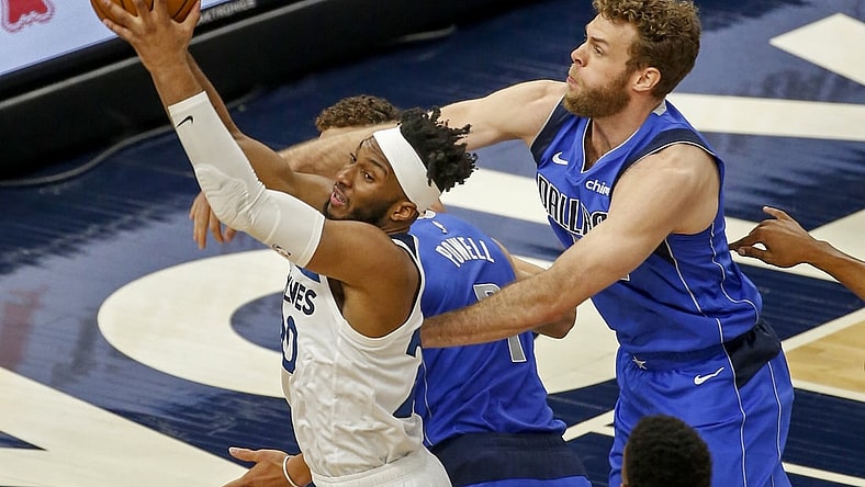 May 16, 2021; Minneapolis, Minnesota, USA; Minnesota Timberwolves forward Josh Okogie (20) grabs a rebound as Dallas Mavericks forward Nicolo Melli (44) defends in the first quarter at Target Center. Mandatory Credit: Bruce Kluckhohn-USA TODAY Sports