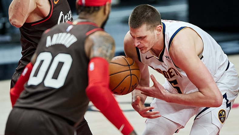 May 16, 2021; Portland, Oregon, USA;  Denver Nuggets center Nikola Jokic (15) loses the ball against the Portland Trail Blazers during the second quarter at the Moda Center. Mandatory Credit: Craig Mitchelldyer-USA TODAY Sports