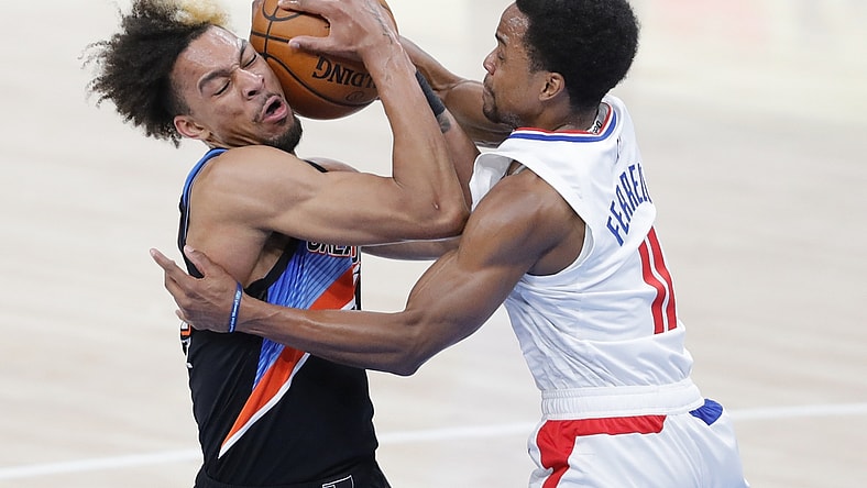 May 16, 2021; Oklahoma City, Oklahoma, USA; Oklahoma City Thunder forward Charlie Brown Jr. (44) and LA Clippers guard Yogi Ferrell (11) battle for the ball during the second quarter at Chesapeake Energy Arena. Mandatory Credit: Alonzo Adams-USA TODAY Sports