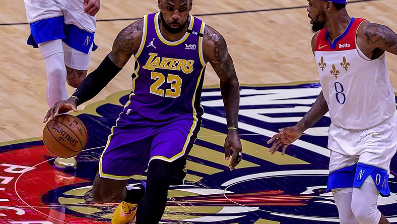 May 16, 2021; New Orleans, Louisiana, USA; Los Angeles Lakers forward LeBron James (23) dribbles against New Orleans Pelicans forward Naji Marshall (8) during the first half at the Smoothie King Center. Mandatory Credit: Stephen Lew-USA TODAY Sports