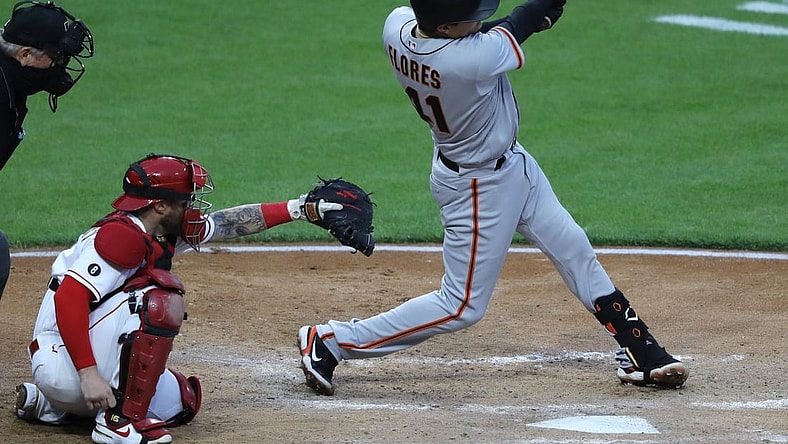 May 17, 2021; Cincinnati, Ohio, USA; San Francisco Giants second baseman Wilmer Flores (41) hits a single against the Cincinnati Reds during the sixth inning at Great American Ball Park. Mandatory Credit: David Kohl-USA TODAY Sports