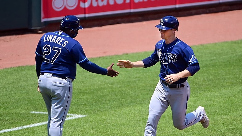 May 20, 2021; Baltimore, Maryland, USA; Tampa Bay Rays shortstop Joey Wendle (18) high fives third base coach Rodney Linares (27) after hitting a home run in the second inning against the Baltimore Orioles at Oriole Park at Camden Yards. Mandatory Credit: Evan Habeeb-USA TODAY Sports
