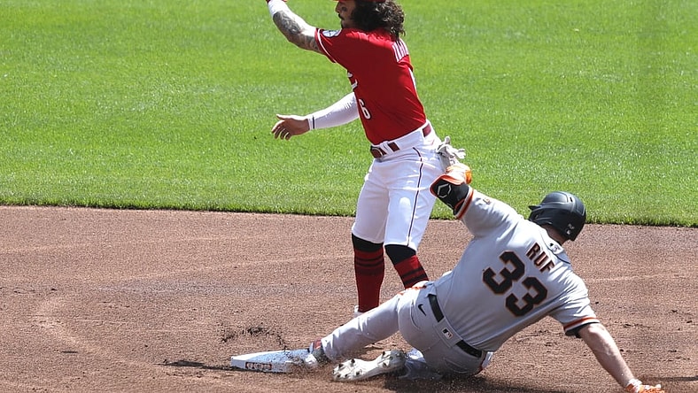 May 20, 2021; Cincinnati, Ohio, USA; San Francisco Giants first baseman Darin Ruf (33) is safe at second against Cincinnati Reds second baseman Jonathan India (6) after hitting a double in the first inning at Great American Ball Park. Mandatory Credit: David Kohl-USA TODAY Sports