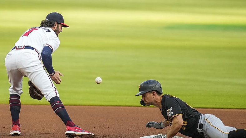 May 20, 2021; Cumberland, Georgia, USA; Pittsburgh Pirates second baseman Adam Frazier (26) slides into second base after hitting a double against the Atlanta Braves during the first inning at Truist Park. Mandatory Credit: Dale Zanine-USA TODAY Sports