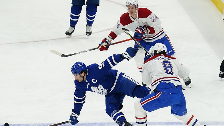 May 20, 2021; Toronto, Ontario, CAN; Toronto Maple Leafs forward John Tavares (91) is hit by Montreal Canadiens defenseman Ben Chiarot (8) during the first period of game one of the first round of the 2021 Stanley Cup Playoffs at Scotiabank Arena. Mandatory Credit: John E. Sokolowski-USA TODAY Sports