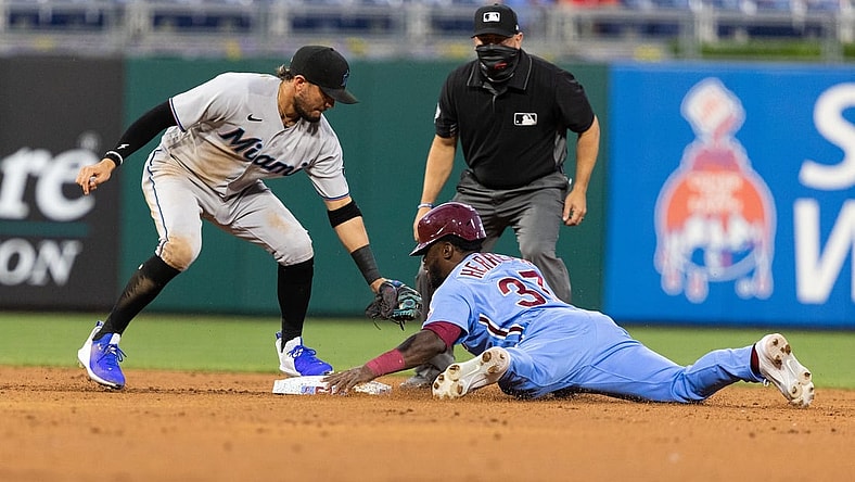 May 20, 2021; Philadelphia, Pennsylvania, USA; Philadelphia Phillies center fielder Odubel Herrera (37) steals second base past Miami Marlins second baseman Isan Diaz (1) during the third inning at Citizens Bank Park. Mandatory Credit: Bill Streicher-USA TODAY Sports