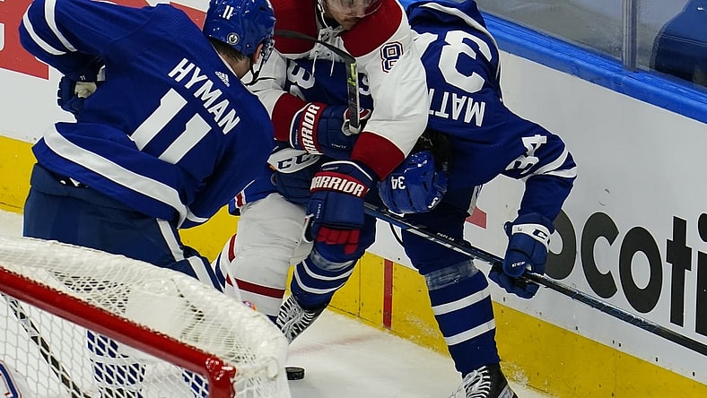 May 20, 2021; Toronto, Ontario, CAN; Montreal Canadiens defenseman Ben Chiarot (8) roughs up Toronto Maple Leafs forward Auston Matthews (34) during the second period of game one of the first round of the 2021 Stanley Cup Playoffs at Scotiabank Arena. Mandatory Credit: John E. Sokolowski-USA TODAY Sports