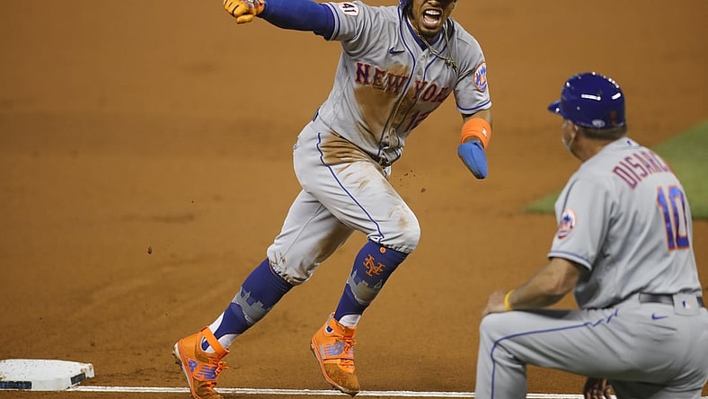 May 21, 2021; Miami, Florida, USA; New York Mets shortstop Francisco Lindor (12) reacts after Miami Marlins third baseman Brian Anderson (15) looses the baseball during the first inning at loanDepot Park. Mandatory Credit: Sam Navarro-USA TODAY Sports