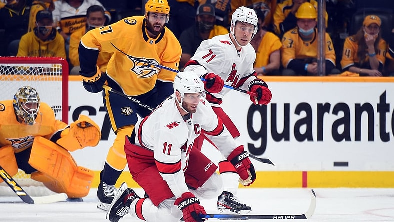May 21, 2021; Nashville, Tennessee, USA; Carolina Hurricanes center Jordan Staal (11) tries to play the puck during the first period against the Nashville Predators in game three of the first round of the 2021 Stanley Cup Playoffs at Bridgestone Arena. Mandatory Credit: Christopher Hanewinckel-USA TODAY Sports