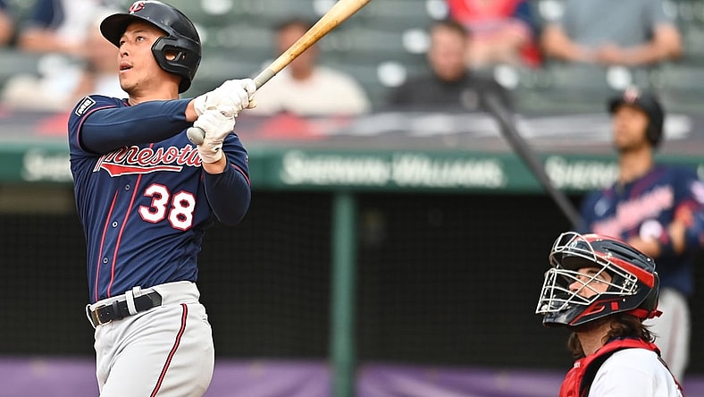 May 21, 2021; Cleveland, Ohio, USA; Minnesota Twins center fielder Rob Refsnyder (38) and Cleveland Indians catcher Austin Hedges (17) watch as Refsnyder hits a home run during the third inning at Progressive Field. Mandatory Credit: Ken Blaze-USA TODAY Sports