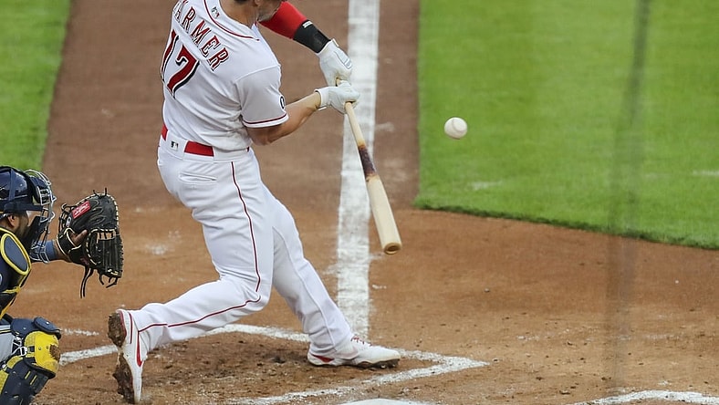 May 21, 2021; Cincinnati, Ohio, USA; Cincinnati Reds shortstop Kyle Farmer (17) hits against the Milwaukee Brewers during the second inning at Great American Ball Park. Mandatory Credit: Katie Stratman-USA TODAY Sports