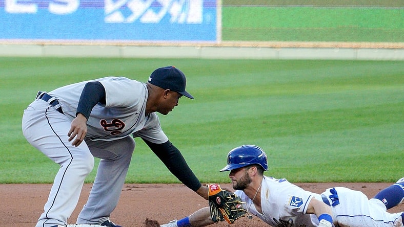 May 21, 2021; Kansas City, Missouri, USA; Kansas City Royals left fielder Andrew Benintendi (16) is tagged out by Detroit Tigers second baseman Jonathan Schoop (7) at second base trying to advance on a single during the first inning at Kauffman Stadium. Mandatory Credit: Denny Medley-USA TODAY Sports