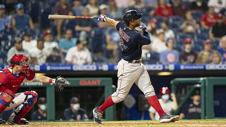 May 21, 2021; Philadelphia, Pennsylvania, USA; Boston Red Sox shortstop Xander Bogaerts (2) hits a single during the fifth inning against the Philadelphia Phillies at Citizens Bank Park. Mandatory Credit: Gregory Fisher-USA TODAY Sports