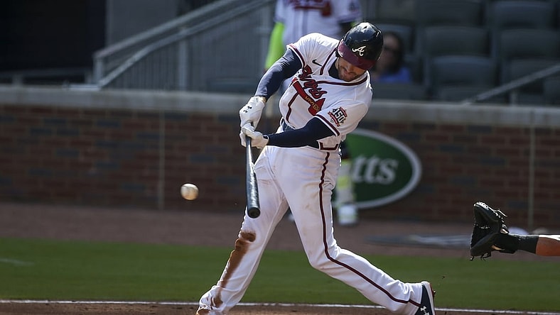 May 22, 2021; Atlanta, Georgia, USA; Atlanta Braves first baseman Freddie Freeman (5) hits a RBI single against the Pittsburgh Pirates in the second inning at Truist Park. Mandatory Credit: Brett Davis-USA TODAY Sports