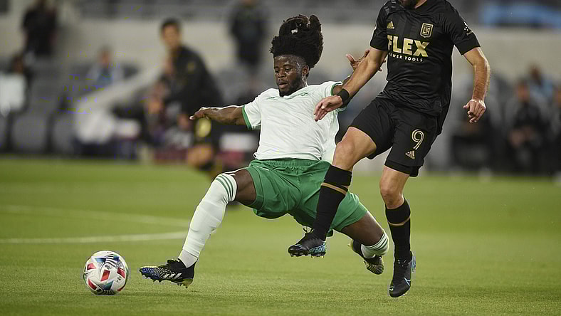May 22, 2021; Los Angeles, CA, USA; Colorado Rapids defender Lalas Abubakar (6) lunges for the ball against Los Angeles FC forward Diego Rossi (9) during the first half at Banc of California Stadium. Mandatory Credit: Kelvin Kuo-USA TODAY Sports