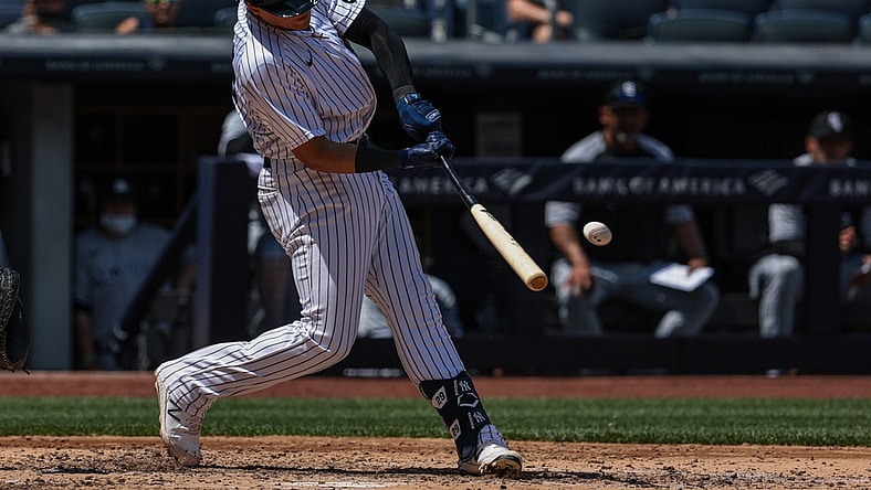 May 23, 2021; Bronx, New York, USA; New York Yankees third baseman Gio Urshela (29) hits a single during the third inning against the Chicago White Sox at Yankee Stadium. Mandatory Credit: Vincent Carchietta-USA TODAY Sports