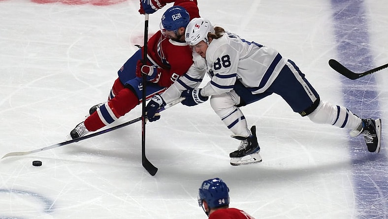 May 24, 2021; Montreal, Quebec, CAN; Toronto Maple Leafs center William Nylander (88) and Montreal Canadiens defenseman Ben Chiarot (8) battle for the puck during the first period of the game three of the first round of the 2021 Stanley Cup Playoffs at Bell Centre. Mandatory Credit: Jean-Yves Ahern-USA TODAY Sports