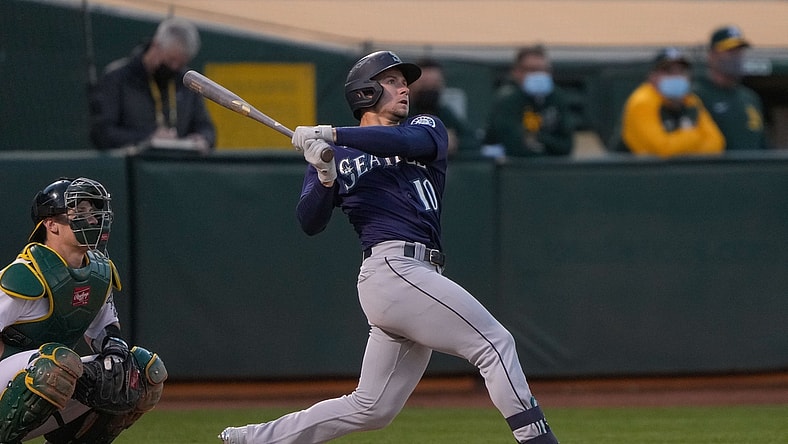 May 24, 2021; Oakland, California, USA;  Seattle Mariners center fielder Jarred Kelenic (10) hits a solo home run against the Oakland Athletics during the fifth inning at RingCentral Coliseum. Mandatory Credit: Stan Szeto-USA TODAY Sports