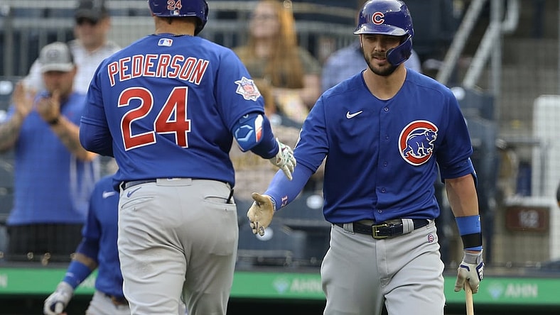 May 25, 2021; Pittsburgh, Pennsylvania, USA; Chicago Cubs right fielder Kris Bryant (right) congratulates left fielder Joc Pederson (24) on his solo home run against the Pittsburgh Pirates during the third inning at PNC Park. Mandatory Credit: Charles LeClaire-USA TODAY Sports
