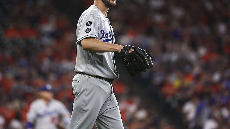 May 25, 2021; Houston, Texas, USA; Los Angeles Dodgers starting pitcher Clayton Kershaw (22) reacts after a play during the second inning against the Houston Astros at Minute Maid Park. Mandatory Credit: Troy Taormina-USA TODAY Sports