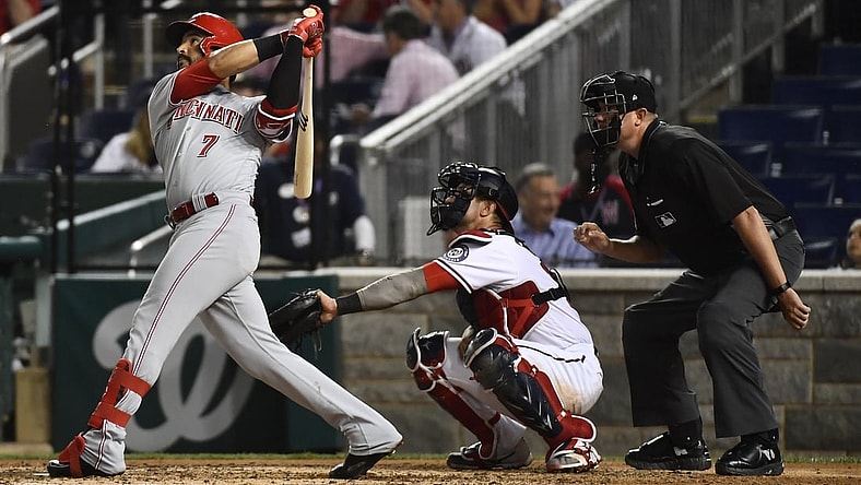 May 25, 2021; Washington, District of Columbia, USA; Cincinnati Reds third baseman Eugenio Suarez (7) hits a solo home run against the Washington Nationals during the sixth inning at Nationals Park. Mandatory Credit: Brad Mills-USA TODAY Sports