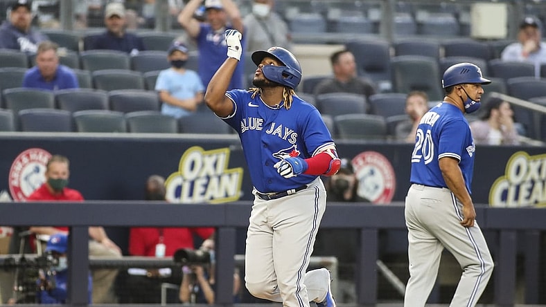 May 25, 2021; Bronx, New York, USA; Toronto Blue Jays first baseman Vladimir Guerrero Jr. (27) points to the sky after hitting a two run home in the third inning against the New York Yankees at Yankee Stadium. Mandatory Credit: Wendell Cruz-USA TODAY Sports