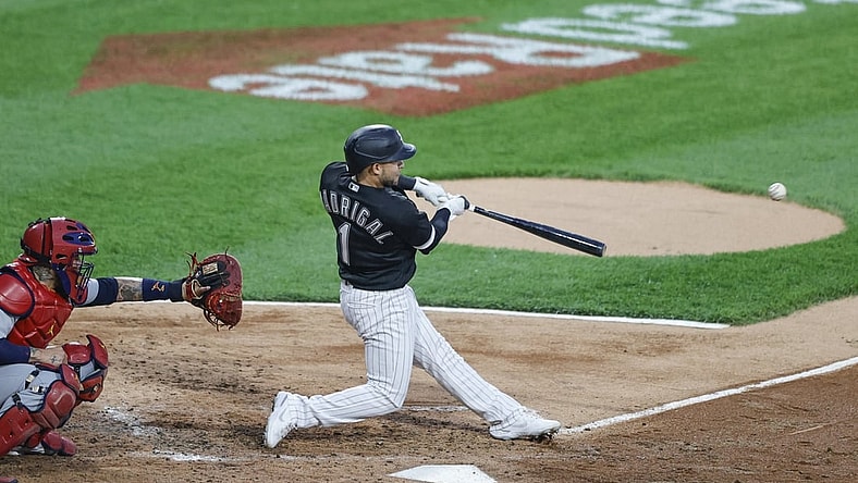 May 25, 2021; Chicago, Illinois, USA; Chicago White Sox second baseman Nick Madrigal (1) hits an rbi single against the St. Louis Cardinals during the second inning at Guaranteed Rate Field. Mandatory Credit: Kamil Krzaczynski-USA TODAY Sports