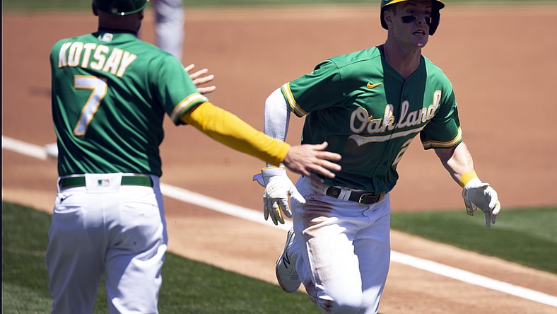 May 26, 2021; Oakland, California, USA; Oakland Athletics designated hitter Mark Canha (20) scores on a ground rule double by left fielder Seth Brown during the first inning against the Seattle Mariners at RingCentral Coliseum. Mandatory Credit: D. Ross Cameron-USA TODAY Sports