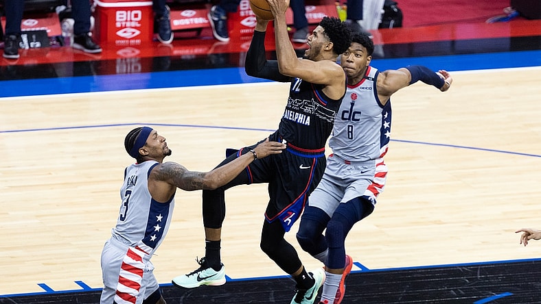 May 26, 2021; Philadelphia, Pennsylvania, USA; Philadelphia 76ers forward Tobias Harris (12) moves to the basket against Washington Wizards guard Bradley Beal (3) and forward Rui Hachimura (8) during the first quarter of game two in the first round of the 2021 NBA Playoffs at Wells Fargo Center. Mandatory Credit: Bill Streicher-USA TODAY Sports