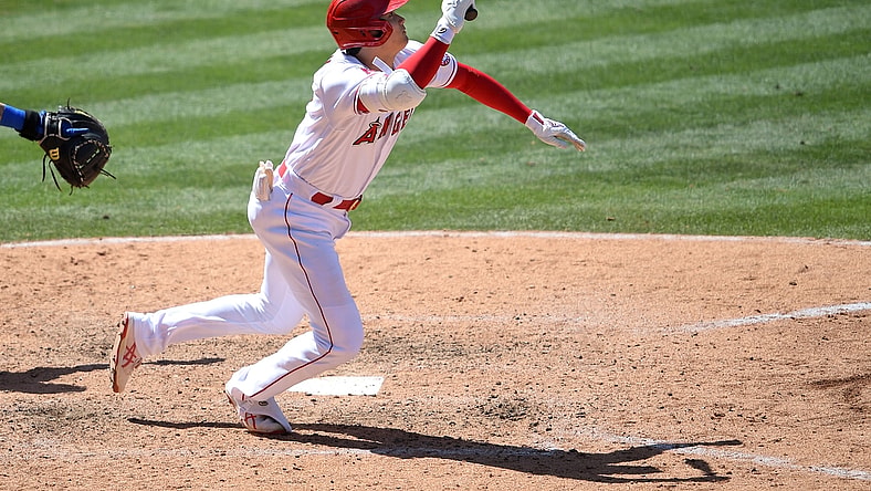 May 26, 2021; Anaheim, California, USA;  Los Angeles Angels designated hitter Shohei Ohtani (17) gets an infield hit in the sixth inning of the game against the Texas Rangers at Angel Stadium. Mandatory Credit: Jayne Kamin-Oncea-USA TODAY Sports