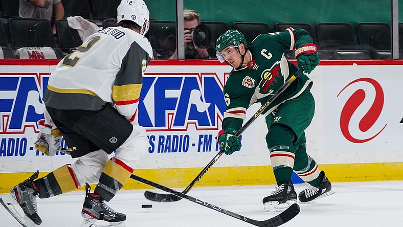May 26, 2021; Saint Paul, Minnesota, USA; Minnesota Wild defenseman Jared Spurgeon (46) shoots against Vegas Golden Knights defenseman Zach Whitecloud (2) in the second period in game six of the first round of the 2021 Stanley Cup Playoffs at Xcel Energy Center. Mandatory Credit: Brad Rempel-USA TODAY Sports