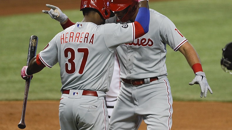 May 27, 2021; Miami, Florida, USA; Philadelphia Phillies first baseman Rhys Hoskins (17) celebrates with center fielder Odubel Herrera (37) after scoring against the Miami Marlins during the fourth inning at loanDepot Park. Mandatory Credit: Sam Navarro-USA TODAY Sports