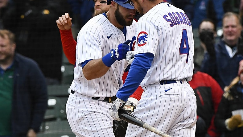 May 28, 2021; Chicago, Illinois, USA;  Chicago Cubs second baseman David Bote (13) is greeted by third baseman Eric Sogard (4) after hitting a home run during the fifth inning against the Cincinnati Reds at Wrigley Field. Mandatory Credit: Matt Marton-USA TODAY Sports