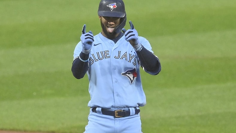 May 28, 2021; Cleveland, Ohio, USA; Toronto Blue Jays left fielder Lourdes Gurriel Jr. (13) celebrates his RBI double during the third inning against the Cleveland Indians at Progressive Field. Mandatory Credit: David Richard-USA TODAY