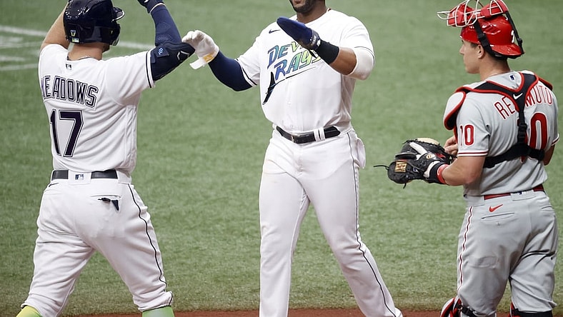 May 29, 2021; St. Petersburg, Florida, USA;  Tampa Bay Rays designated hitter Austin Meadows (17) and Tampa Bay Rays first baseman Yandy Diaz (2) celebrate as they score runs during the first inning against the Philadelphia Phillies at Tropicana Field. Mandatory Credit: Kim Klement-USA TODAY Sports