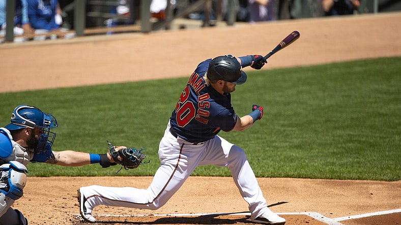 May 29, 2021; Minneapolis, Minnesota, USA; Minnesota Twins third baseman Josh Donaldson (20) hits a single during the first inning against the Kansas City Royals at Target Field. Mandatory Credit: Jordan Johnson-USA TODAY Sports