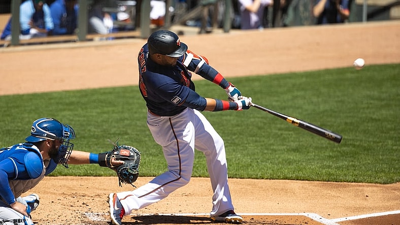 May 29, 2021; Minneapolis, Minnesota, USA; Minnesota Twins designated hitter Nelson Cruz (23) hits an RBI ground rule double during the first inning against the Kansas City Royals at Target Field. Mandatory Credit: Jordan Johnson-USA TODAY Sports