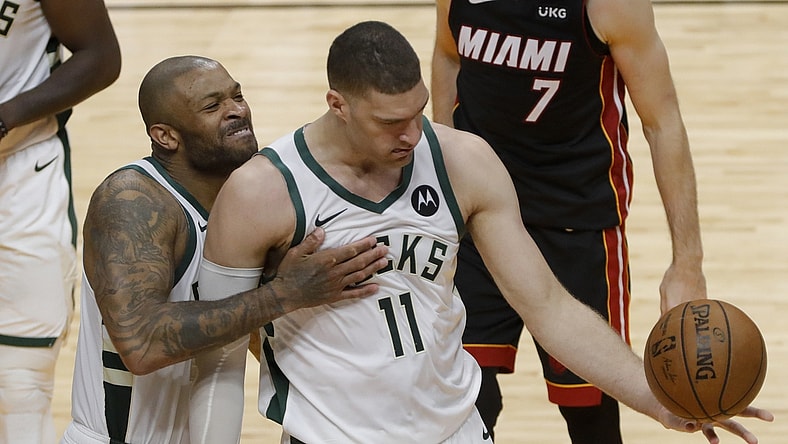 May 29, 2021; Miami, Florida, USA; Milwaukee Bucks forward P.J. Tucker (17) celebrates with center Brook Lopez (11) after scoring against the Miami Heat during the fourth quarter of game four in the first round of the 2021 NBA Playoffs at American Airlines Arena. Mandatory Credit: Sam Navarro-USA TODAY Sports