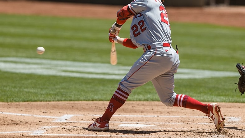 May 30, 2021; Oakland, California, USA; Los Angeles Angels shortstop David Fletcher (22) hits a two-RBI double against the Oakland Athletics during the second inning at RingCentral Coliseum. Mandatory Credit: John Hefti-USA TODAY Sports