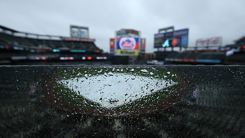 May 30, 2021; New York City, New York, USA; General view of a tarp on the field as rain falls at Citi Field. Tonight's game between the New York Mets and the Atlanta Braves has been postponed due to inclement weather. Mandatory Credit: Brad Penner-USA TODAY Sports