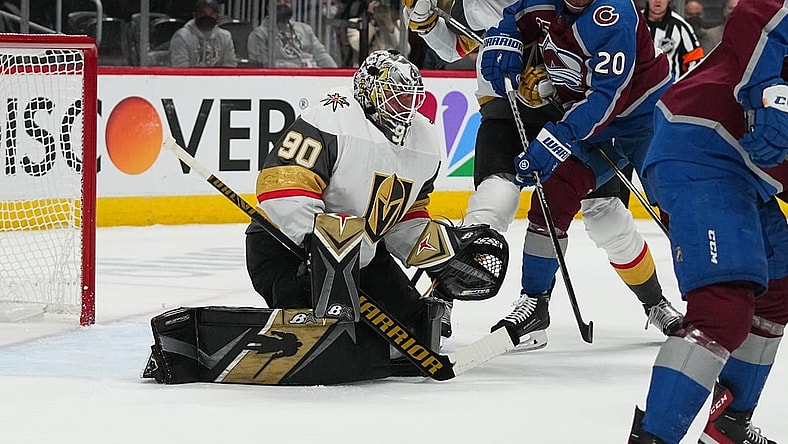 May 30, 2021; Denver, Colorado, USA; Vegas Golden Knights goaltender Robin Lehner (90) defends his net from left wing Brandon Saad (20) in the first period of game one in the second round of the 2021 Stanley Cup Playoffs at Ball Arena. Mandatory Credit: Ron Chenoy-USA TODAY Sports