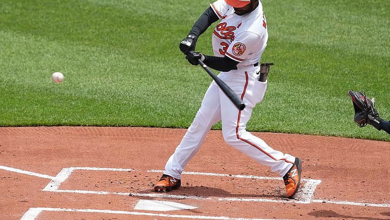 May 31, 2021; Baltimore, Maryland, USA; Baltimore Orioles outfielder Cedric Mullins (31) connects on a first inning double against the Minnesota Twins at Oriole Park at Camden Yards. Mandatory Credit: Mitch Stringer-USA TODAY Sports