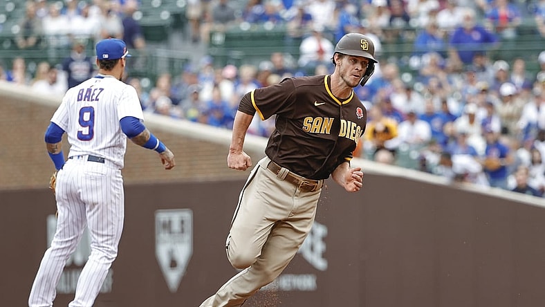 May 31, 2021; Chicago, Illinois, USA; San Diego Padres right fielder Wil Myers (5) runs to third base on a single hit by San Diego Padres left fielder Jurickson Profar (not pictured) against the Chicago Cubs during the second inning at Wrigley Field. Mandatory Credit: Kamil Krzaczynski-USA TODAY Sports