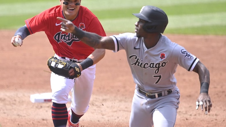 May 31, 2021; Cleveland, Ohio, USA; Chicago White Sox shortstop Tim Anderson (7) reacts as he is chased by Cleveland Indians shortstop Yu Chang (2) during a rundown in the second inning at Progressive Field. Mandatory Credit: David Richard-USA TODAY Sports