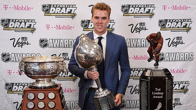 Jun 21, 2017; Las Vegas, NV, USA; Edmonton Oilers forward Connor McDavid poses for a photo with the Art Ross Trophy, Hart Trophy and Ted Lindsay Award in the interview room during the 2017 NHL Awards and Expansion Draft at T-Mobile Arena. Mandatory Credit: Stephen R. Sylvanie-USA TODAY Sports