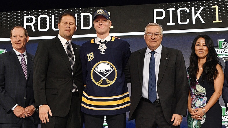 Jun 22, 2018; Dallas, TX, USA; Rasmus Dahlin poses for a photo with team executives after being selected as the number one overall pick to the Buffalo Sabres in the first round of the 2018 NHL Draft at American Airlines Center. Mandatory Credit: Jerome Miron-USA TODAY Sports
