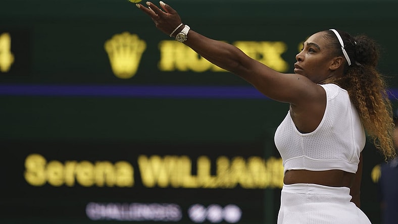Jul 13, 2019; London, United Kingdom; Serena Williams (USA) serves during a match against Simona Halep (ROU) on day 12 at the All England Lawn and Croquet Club. Mandatory Credit: Susan Mullane-USA TODAY Sports